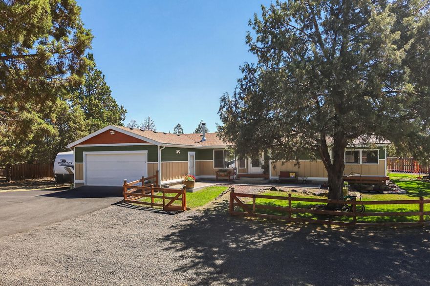 ATTENTION! Seller is offering up to a $10,000 SELLER CREDIT with the right offer. Welcome to your dream home nestled in the heart of the Crooked River Ranch resort. This gem sits on a sprawling 1.03 acres of fully fenced, park-like setting. The property boasts playground equipment and a fenced-off garden area, perfect for those with a green thumb. The home itself offers 1,456 SqFt of open concept living space, featuring 3 bedrooms and 2 baths. Each room is filled with character and charm, thanks to the numerous updates. The large primary bedroom comes with an en-suite bathroom, complete with a relaxing soaking tub and separate shower. French doors lead you out to an attached, screened-in sunroom and porch - the perfect spot for your morning coffee or evening relaxation. The exterior of the home is just as impressive, with new Hardie plank siding and fresh paint, extending to the shed and carport. And let's not forget the beautiful, freshly stained decks with an outlet for a hot tub.