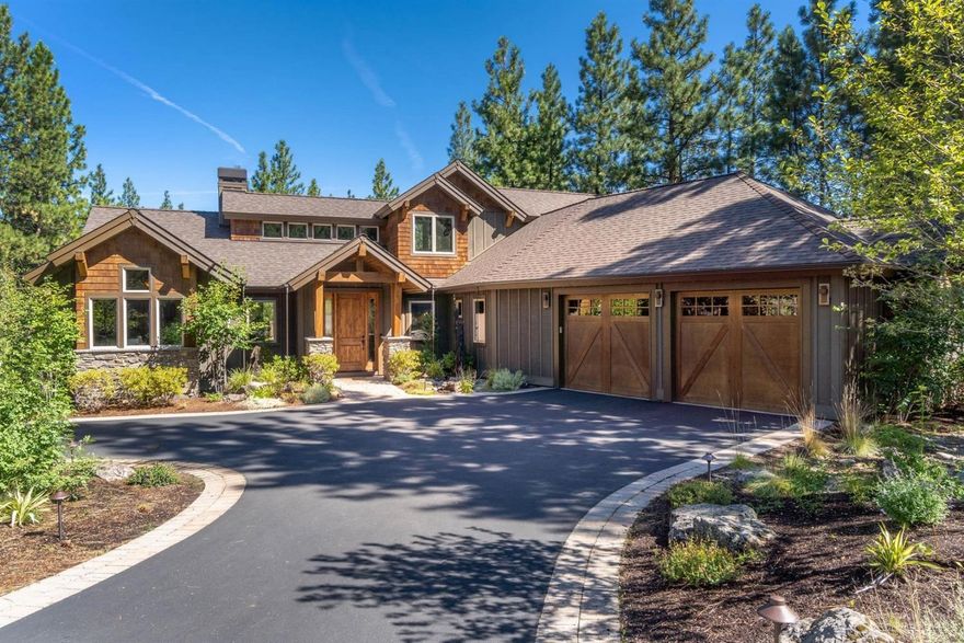 Privately nestled in the pines on a cul-de-sac in Tetherow, find this NW style Craftsman, built to high level standards w/ the pinnacle of custom finishes. Very livable open floorplan enjoys mostly main level living w/only a spacious Jr Suite/convenient flex space atop a short flight of stairs. Lovingly cared for by single owners, this 4BD, 3.5BA home boasts high ceilings, tall doors, Lg windows allowing views of wooded lot, beam work, gorgeous use of natural stone & modern transitional style w/ Northwest lodge accents. Chef's Kitchen features Dacor and Fischer & Paykel appliances, natural edge granite & hammered copper. Stacked rock floor to ceiling FP provides focal point in the living space. Walk in Master to views of swaying pines. Wide plank hand-scraped hardwood floors continue here & there is pvt access to deck w/ firepit & sunken hot tub. Master bath features copper soaking tub w/ jets & W/I tiled shower. Guest bedroom 1 features deck access while 2nd is current office.