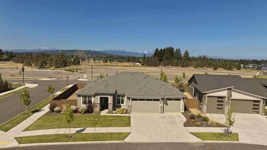 Discover this bright, single-level home in the desirable Petrosa community of NE Bend. Situated on a larger-than-average corner lot, the backyard is a blank slate for your landscaping creativity. The seller is even offering a credit of $20,000 towards the backyard landscape. Inside, generous windows fill the space with warm, natural light, highlighting custom touches curated by the seller—including designer paint, stylish light fixtures, open shelving, and built-ins. The kitchen offers plentiful cabinetry and a large island, ideal for gathering. The luxurious primary suite features a freestanding soaking tub, tile shower, and a spacious dual vanity with abundant storage. A junior suite adds flexibility for guests or multigenerational living. The three-car garage offers extra space for storage or hobbies. Enjoy all that Petrosa has to offer, including a park, community pool, fitness center, and more. A beautiful blend of comfort, character, and convenience.