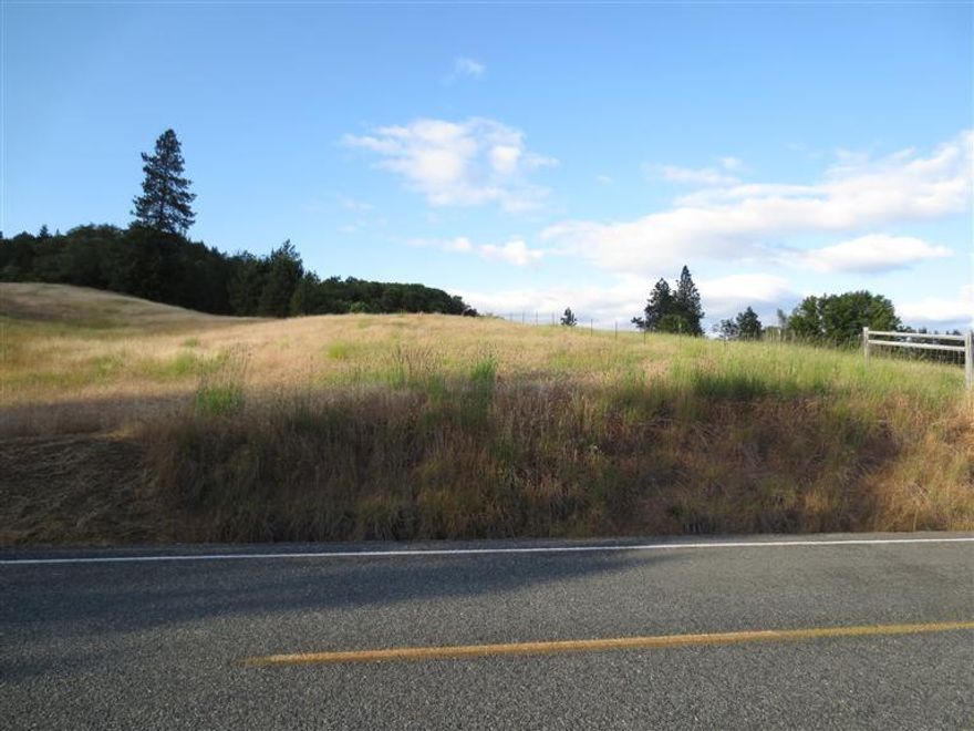 Majestic mountain views from the 3.16 acre rolling parcel. Located in Kalea Estates off of Lower River Road; across from Whitehorse Park. Build your dream home here on this lovely property in a cul-de-sac and close to town and the famous Rogue River. There is a standard septic approval and low county taxes. Take a drive by this today. Three other lots available.