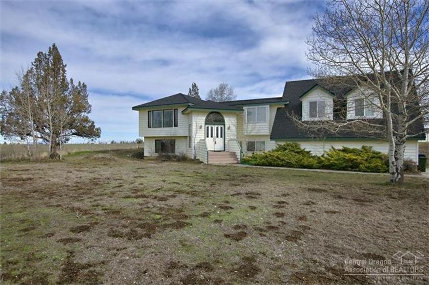 Affordable Country Home - Close In! Spectacular Cascade views from both levels of this 3140 sf 4 bed/3 bath home! Built in 1975, it needs updating, but offers a ton of living space for the money--2 living areas, a huge bonus space and more. On just under 5 acres (4.5 with irrigation) with 2 fenced pastures for your animals, plus land to spare for planting. Minutes to downtown Bend and Parkway.