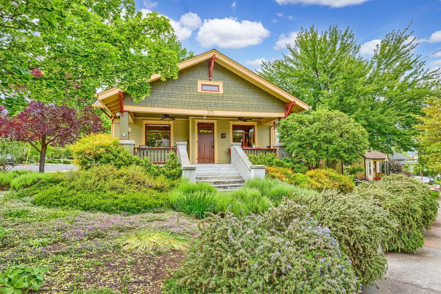 Charming 1920s Craftsman on large corner lot in a prime close-to-downtown location. Zoned R-2 w/ room & flexibility for an ADU or additional dwelling (buyer to verify). This home offers unbeatable curb appeal, period character & tasteful updates. Features include fir floors, plaster walls, built-ins, window seat, & welcoming covered front porch. Main floor includes primary bedroom, full hall bath, spacious LR, DR, flex rm, den/office/BR, & cheerful kitchen w/ newer appls and attached enclosed screened porch. Upstairs you'll find a lg bonus rm & 2nd bath—great for guests, hobbies, or studio. Owner updates: sewer line to curb (2020), new HVAC (2013), newer kitchen appls, & vintage-style restoration fixtures. The fully fenced back & side yards offer privacy, mature landscaping & space for entertaining or play. An ideal blend of timeless style & modern comfort in an accessible neighborhood close to parks, shops, restaurants & all that downtown has to offer!