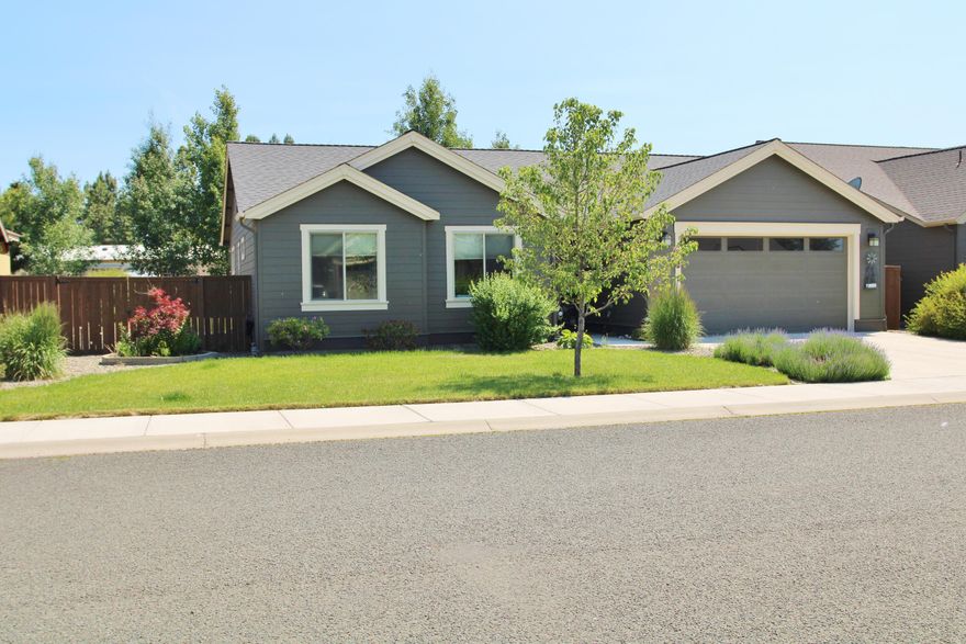 One owner/like new condition 2015 year built home available w/ 3 bedrooms, 2 bathrooms & extended bay 2 car garage w/ room for east-side RV parking if added! Super single level living w/ open great room style floor plan, 9' & coffer-ed ceilings & custom window treatments throughout. Beautiful knotty alder cabinets w/ attractive quartz solid surface counters, stunning kitchen w/ under cabinet windows & lighting, handy walk-in pantry, huge center island, stainless steel appliances & washer dryer too! The great room living area provides huge windows, a stacked stone gas fireplace, dining space & more. The super primary on-suite bedroom provides coffer-ed ceilings, attractive lighting, walk in closet, double vanities, linen closet & walk-in shower too. Some upgraded carpet & LVP/Laminate flooring, attractive mature landscaping & trees, beautiful 20 x 10 +/- covered patio for BBQ's, beautiful lot & trees w/ F/B in-ground sprinklers, F/A gas heat & more! 2023 Taxes of $2118.09 w/ NO VA exmp