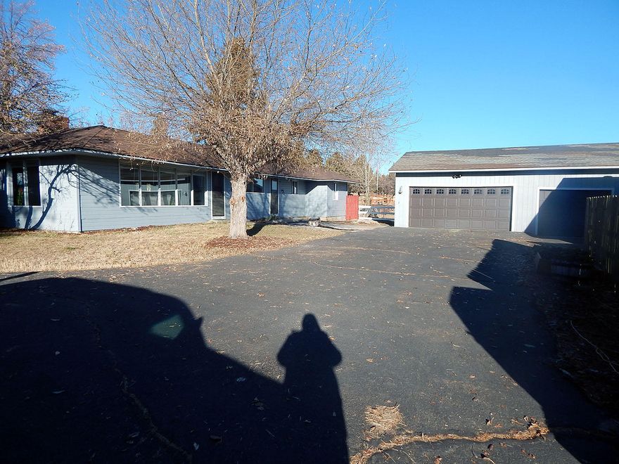 Located just outside of Klamath Oregon, this lovely home located on 1.35 acres.   This property is  fenced and cross fenced ready for hobby farming.  There has been some updates throughout the home.  The home features, 4 bedrooms, living room, updated great room off of the kitchen, main suite with walk in closet, split floor plan, a 5 car garage with a shop area for projects, an animal shelter, green house, even comes with a pirate ship play house.  Easy to show.