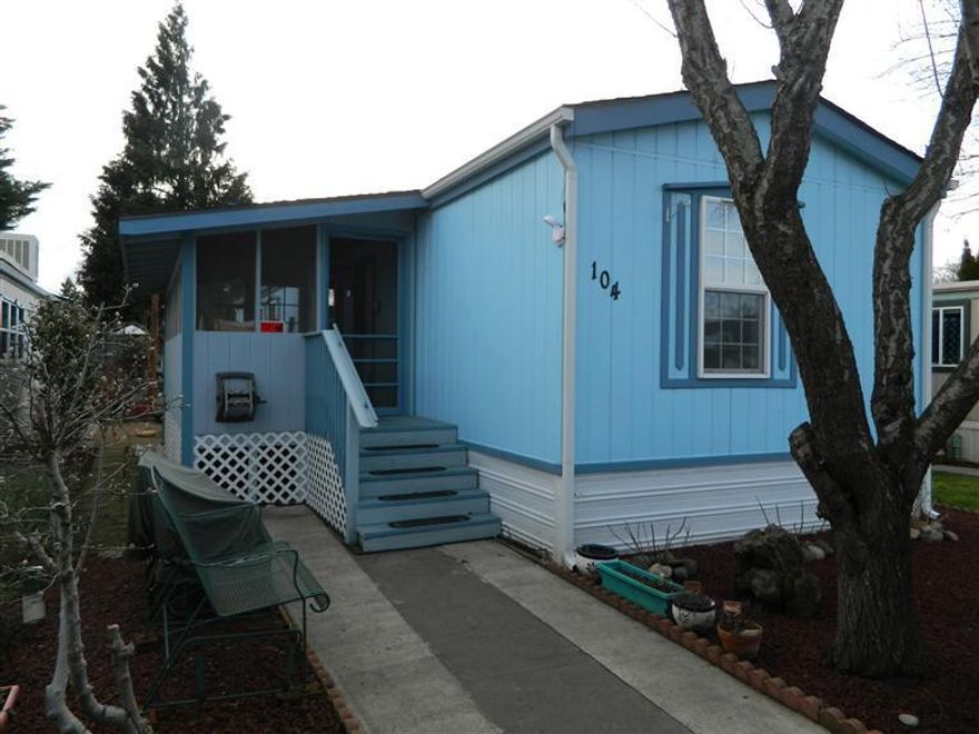 Beautifully cared for Fleetwood home with lovely landscaping. Spacious open floor plan with split bedrooms. Master with private bathroom, kitchen features island & pantry, living room has chapel ceiling and new laminate flooring. Laundry room. Screened front porch, Insulated 10 x 15 hobby shed. Single carport with storage shed. This home has so much to offer. New roof in 2010. New hot water Dec. 2013.