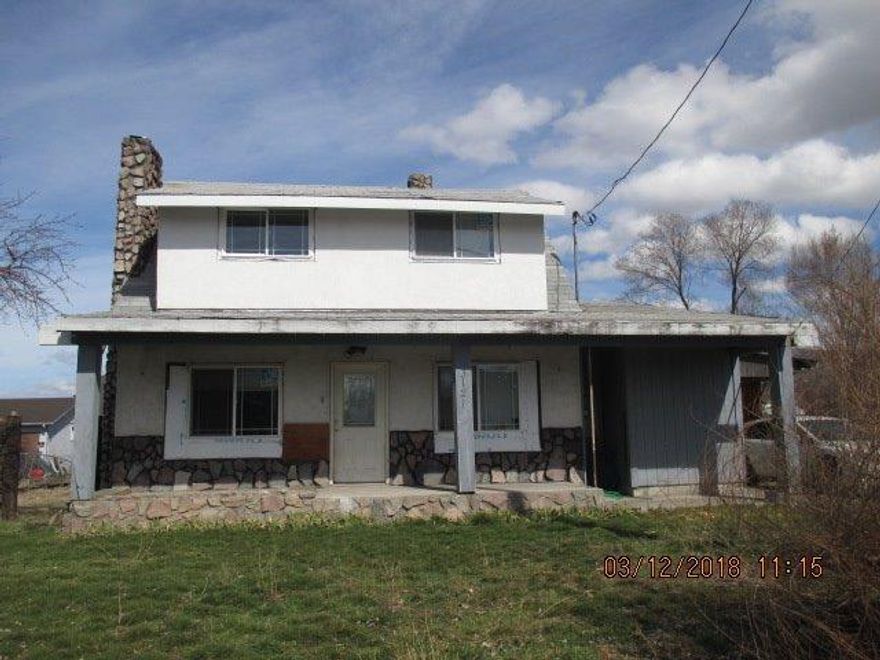 This is a must see property! The owner has updated the interior very nicely, new wood flooring in the living room is stunning and the tile work in the bathrooms is amazing! There is a detached garage and a 30x40 shop building that were damaged by fire but could be rebuilt. The exterior needs TLC but you have to see inside this home to truly appreciate it.