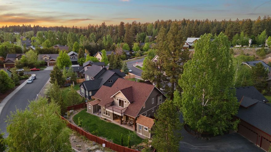 Tucked at the end of a quiet cul-de-sac in NW Bend, this Westside craftsman sits on a rare .23-acre lot with a sunny, level backyard that lives like its own outdoor room—ideal for gatherings, play, or peaceful mornings. With no direct rear neighbors, you'll enjoy added privacy and a sense of space that's hard to find. Just 0.9 miles to The Grove. New roof and interior paint in 2025. HVAC with humidifier, water heater w/ circulation pump, and exterior paint all updated in 2022. Inside, tall ceilings and great natural light shape a layout that lives easy—open living, walk-in pantry, central island, built-ins, and newer appliances flow straight to the covered patio. Upstairs, the expansive primary suite is a true retreat with lounge space, spa-style bath, and private balcony. A main-level office, oversized laundry/mudroom, and spacious garage support daily life. Out back: a finished studio for work, art, or wellness—and a bonus shed for your Bend gear.