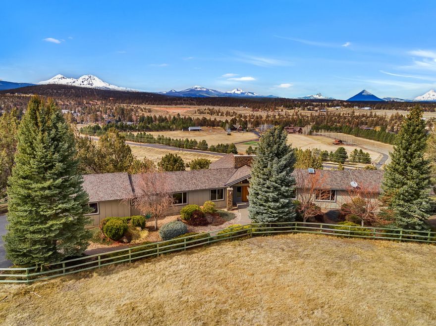 Huge panoramic Cascade Mtn Views! Spectacular updated 2830 sq/ft single level ranch, privately situated in Winston Ranch. Features include beautiful cabinetry, concrete countertops, Miele appliances, floor to ceiling stone fireplace w/ Regency insert, professional plastered walls, grand valuted living room, panoramic views from almost every window. Wonderful primary suite, formal office, and abundant storage & built-ins. Detached 864 sq/ft studio/office with guest suite.  Oversized 2 car garage, newer roof, newer windows, well improvements including new pump in 2020, lush 2.86 irrigated pastures, fully fenced, and situated on 6.2 acres in Tumalo.