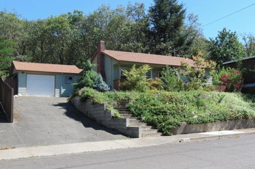 Really Cute Cottage in North West Grants Pass. This 2 bedroom, 1 bath, 1040 sq ft home has so much charm, you'll fall in love as soon as you go inside. The home has an easy living floor plan, separate laundry room with lots of storage, double paned vinyl windows, forced air gas heat with central air, wood and tile flooring throughout, new 30yr roof in 2013, covered front porch and new covered back deck, backs up to large wooded city park. This home feels so much bigger than it looks. Come see it before it's gone. All information deemed reliable but not verified anyone considering the purchase of this property should perform their own investigation into the uses and conditions of the property.