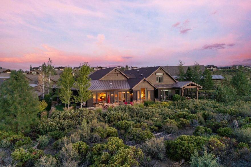 Exceptional single level Triple Knot Townhome in Tetherow with Cascade Mountain views and a backdrop of natural landscaping. The 2,357 sq ft open floor plan features high ceilings, expansive windows, and a chef's kitchen with island and high end appliances. The primary suite offers a spa-like bath,  walk-in shower, and custom closet. A versatile den can serve as a third bedroom. Enjoy seamless indoor-outdoor living with a private patio, perfect for entertaining or relaxing. Minutes from downtown Bend, Mt. Bachelor, and the Cascade Lakes, with world-class recreation right out your front door. Highly sought after, low-maintenance living in one of Central Oregon's premier communities.