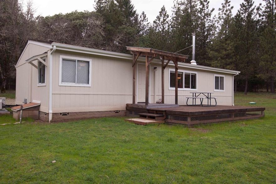 Are you looking for remote and mostly secluded property? Seasonal creek passes on the corner of the property. Only 20 minutes from Grants Pass. Incredibly beautiful property with approximately half of it flat and pasture like. Seller state a 20 GPM well, with a 10 GPM pump. This is a twice moved manufactured home and probably will not qualify for conventional financing. Washington Federal states they have a loan program for this.