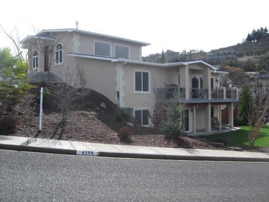 Spacious, and beautifully remodeled home in 2010, This East Medford Modernistic luxury home is loaded. Radiant heated floors, central vacuum system, 5th bedroom currently used as an office. Gas fireplace, stainless steel appliances, fantastic hood in the Chef's kitchen. Pantry of course, and formal dining room. Vaulted ceilings, 3 car garage, and large walk in closets. Master bedroom and bath are fantastic with jetted tub and dual headed shower. Wet bar, trex deck. In an area of amazing homes and the views are plentiful. 3377 square feet to enjoy as your new home. New Heating and air system on lower level in 2017.