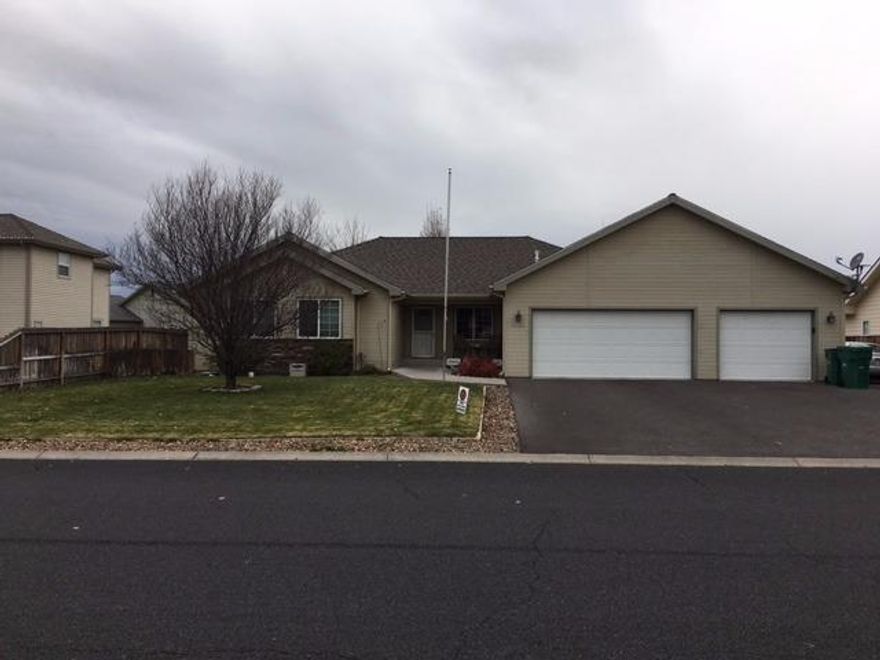 Sunset Village home! Hard to find 4 bedroom 2 bath home with three car garage. This property is neat and tidy with large bedrooms and closets. Both living room and family rooms are bright and open to kitchen. Nice manicured back lawn with in ground sprinklers and side parking. Jack and Jill tiled bathroom and nice size master bathroom.