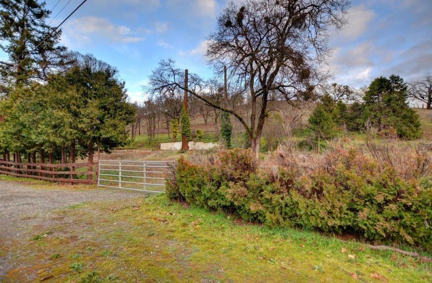 The old house is torn down and gone, which means that all the utilities are in! Well, septic, driveway,.....it's all there! The land has been sculptured, and all it is with a whopping 6.86 acres on beautiful Dark Hollow Road. Quiet, serene, tranquil. Bring your dream home ideas and go take a look!