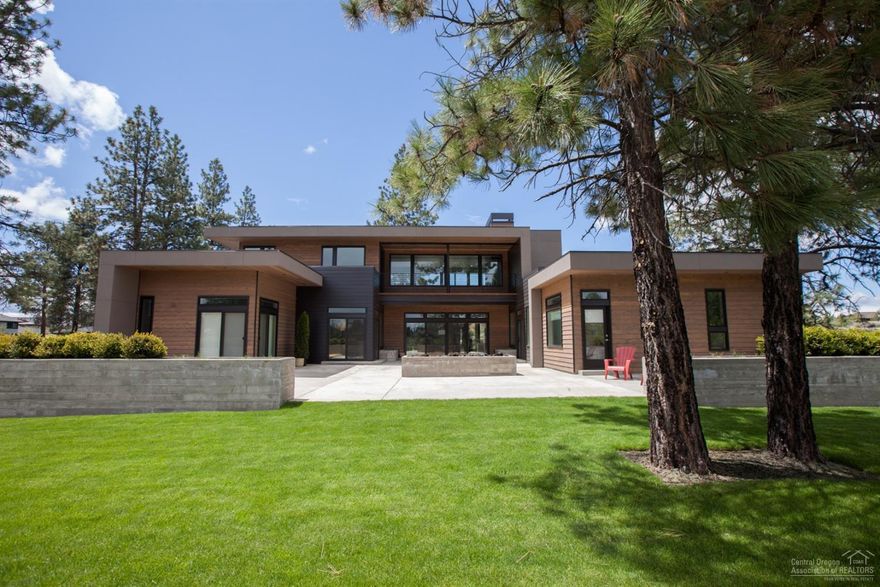 Newly completed bright & modern custom home on .93 acre lot in Tetherow. Chef's kitchen w/top of the line appliance package & butlers pantry. European oak wide plank hardwood floors, imported tile & solid surface counters throughout. Main level master spa suite w/heated floors & walk in double master closet. Single level living with the master, two bedroom suites, office & 4+ car garage on the main level. 3 outdoor living spaces w/the large East courtyard encompassed by privacy berms facing the #12 green.