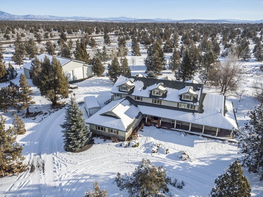 West Powell Butte Estates Home on 20 acres with a park like setting. Traditional style home is 3220 sq ft, large living room filled with natural light, wood floors, vaulted ceilings and gas fireplace. Main level master upstairs master suites, updated finishes throughout, attached 4 car garage with workbench. Wonderful outdoor living spaces with covered patio, hot tub, wraparound deck, water feature, landscaped fenced yard and trees. Shop is 54x60, 3 bays, plumbed for a bathroom/office and has 12x60 storage or livestock shelter. Wonderful opportunity to enjoy a little space with easy convenience to town and Redmond airport.