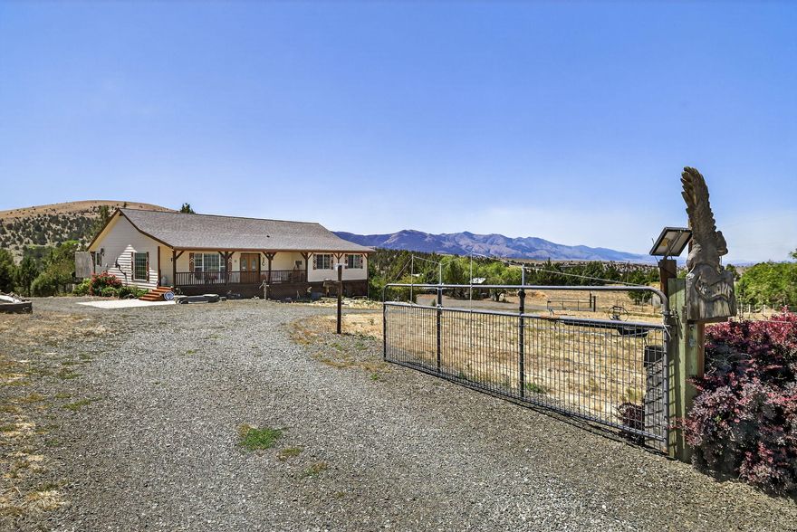 Private Country Comfort with Expansive Views! Charming 3-bedroom, 2-bath home built in 2007, situated on 10.61 view acres. Open-concept home with a kitchen featuring beautiful hickory cabinetry, a corner sink, a spacious island for prep or gathering, and a central vacuum system for easy upkeep. Wide hallways add accessibility and comfort throughout. Outside, your possibilities are endless: Two-car garage with 936 sq ft of storage, complete with shelving and a workshop space. Large shop, RV shed, and dedicated RV pad with hookups, fenced garden, chicken coop, and several frost-free spigots for year-round utility. Covered front porch, rear deck, and a landscaped circular driveway for easy access and entertaining. The home is equipped with a propane heat pump, and a strong 15 GPM well supports outdoor projects and livestock.