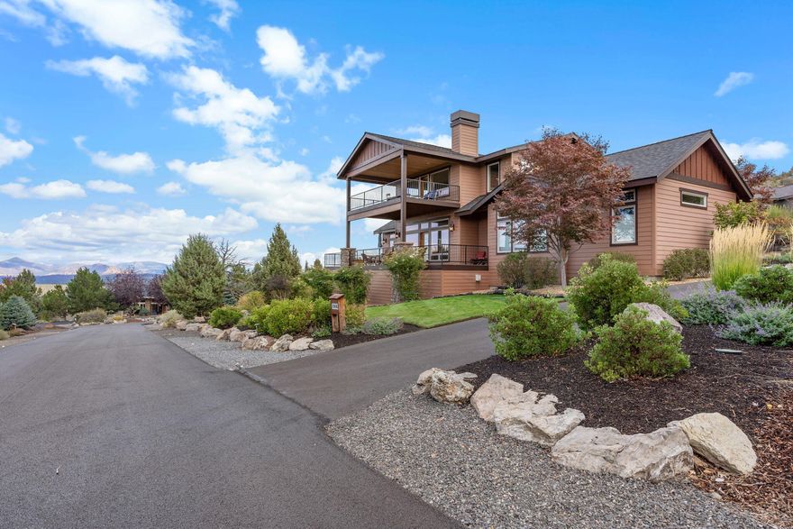 Welcome to this beautiful custom-built home in the sought-after Eagle Crest community! With panoramic mountain views, including the iconic Smith Rock, this property offers a picturesque backdrop that will take your breath away. The open floor plan and spacious kitchen with high-end appliances and stunning granite countertops are perfect for those who love to entertain. The 1,000+ square foot decks provide ample space for outdoor gatherings while taking in the stunning scenery. Inside, you'll find tray ceilings and hand-scraped hickory floors that add a touch of elegance. The large primary suite is a true oasis, featuring a soaking tub and a spacious tile shower. And let's not forget about the neighborhood amenities! From the golf course to the park, trails, sport courts, and pool, there's something for everyone here. Don't miss your chance to own this exquisite property and experience the true meaning of luxury living in the heart of Eagle Crest.