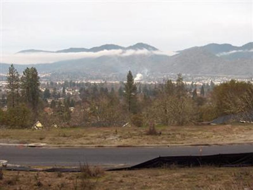 Call Chris Barnett 541-660-5195 or visit www.GrantsPassRealEstate.us Grants Pass's finest subdivision .29 acres in Beautiful Meadow Wood. Lot 86 is in a great location. Enjoy a spectacular view of the city of Grants Pass. Close to town, Great neighborhood of new homes. Need a builder? Call Chris 541-660-5195 to have your new dream home built here today! For this lot and other fine homes visit www.GrantsPassRealEstate.us