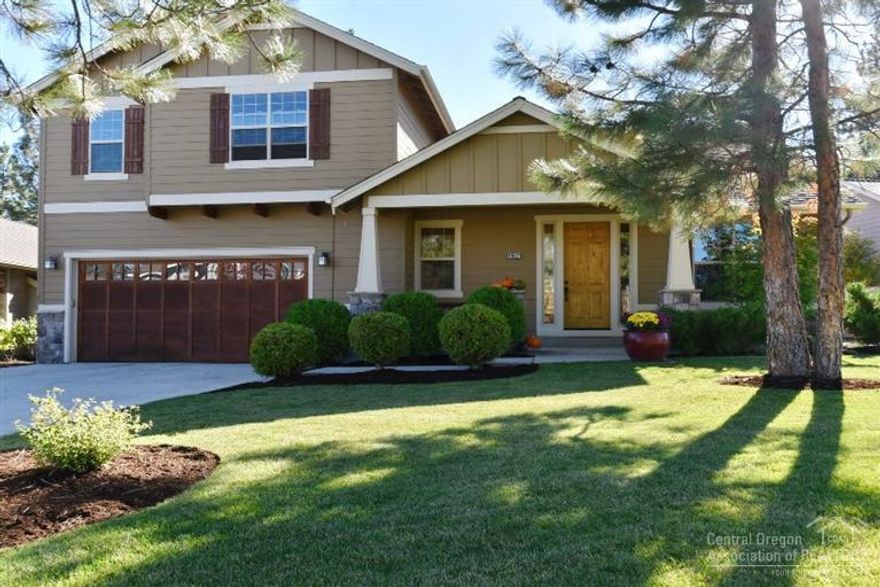 Stunning River Rim home! Beautifully landscaped front yard w/unusually long driveway to 3-car tandem garage w/ plenty of storage. Light/bright vaulted great room draws you to the views of UGB private property. Solar panels, hardwood floors, granite counters, SS appliances, wood wrapped windows, vaulted den, master on the main, vaulted upstairs bonus room and two more bedrooms & bath. Great location in River Rim, only 2 blocks to the Brookswood Shopping Center and walking trails. Welcome Home!