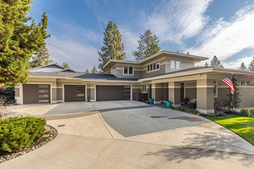 MOTIVATED SELLER!! Main Level Primary and 4 Car Garage! Stunning property in coveted NW Crossing! A luxurious modern home with many premium features.  On the main level, a large office, custom built in wet bar with wine storage and a kegerator and tap, sizable kitchen with beautiful appliances, spacious solid-surface counters, and stunning wood cabinets. Smart home features include the ability control music, lights, locks, and blinds from your phone/in-home iPad. Main-level primary suite includes a large bathroom with dual vanities, heated floors and a walk-in shower and walk-in closet with custom walnut built-ins. Built-in barbecue grill on the elevated back deck. Additional features include a RO water filtration in kitchen, built in air lines in the garage for a compressor and tools, extra full size fridge in garage, built in vacuum system and heated garage.