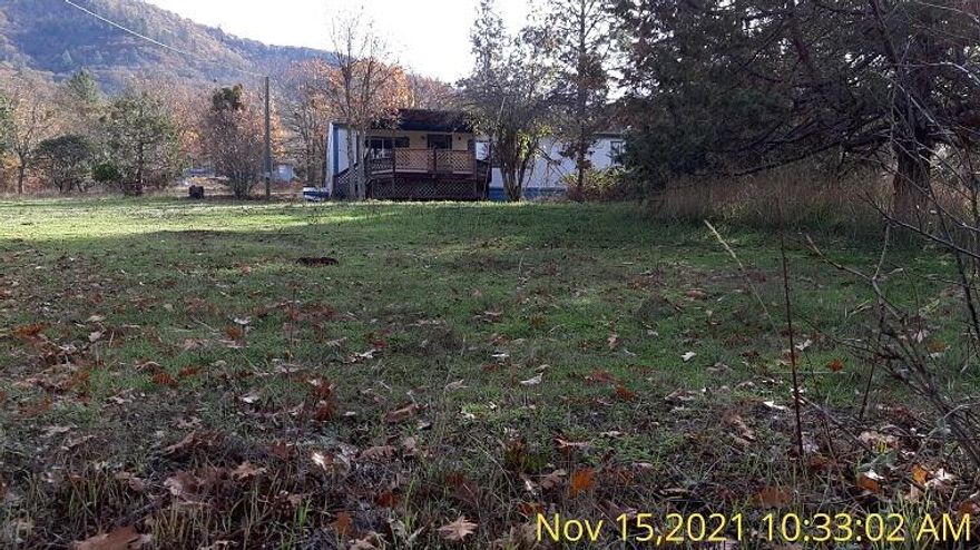 This is a double wide manufactured home on 1.04 acres in a nice rural area yet close to town. It has 3 bedrooms and 2 bathrooms, and 1188 sq. ft. of living area. This is an REO property that needs repairs done. It will not finance in it's current condition. All information deemed accurate but is subject to change.