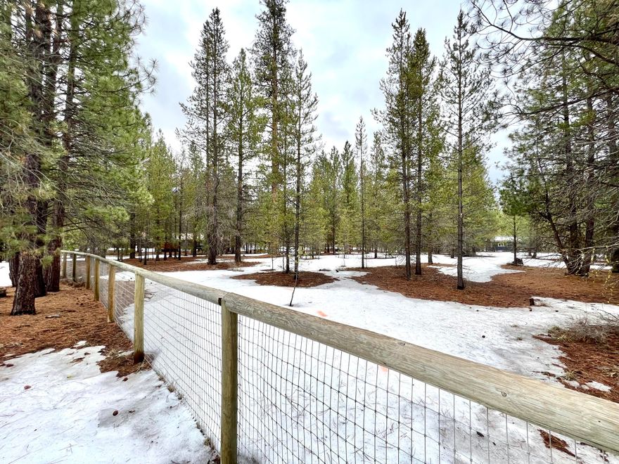 Private wooded over an acre lot in desirable Ponderosa Pines culdesac. Property backs to rare 1400ac parcel that makes for convenient recreation out your back door. Fenced on three sides, with community water and power at edge of property. Will require new septic. Bring your plans to build a dream home in the Pacific Northwest! *Seller is a licensed realtor in the state of Oregon