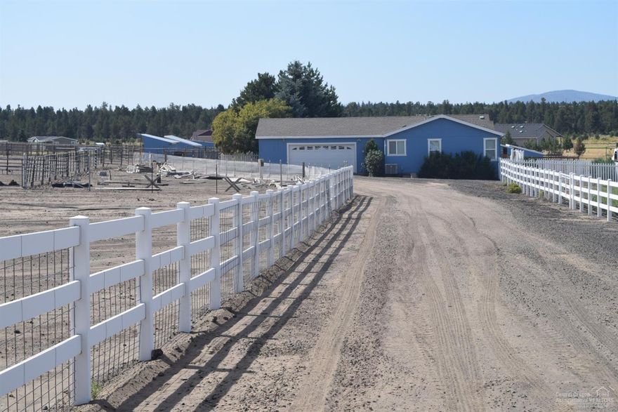 First time ever on market. Cascade views galore at this 1,600 sq. ft. lightly lived in home on 5+ acres that was previously used for guests only. This is a fully fenced and cross fenced equestrian property with multiple loafing sheds. Large 2 bedroom, 2 bath with custom built-in cabinetry, heat (a/c-heat) pump, plus large propane fireplace, separate dining and living rooms plus breakfast/morning room area. Big Garage with ADA ramp, large covered deck overlooking fenced and treed garden area. Be a part of and enjoy the great neighbors at Crooked River Ranch.