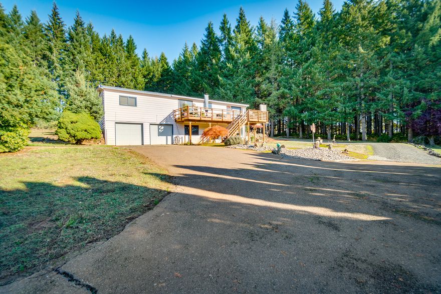 On 10 beautiful, gently south facing sloped acres overlooking the Yamhill valley, sits a comfortable 2 bedroom 2 bath mobile home uniquely remodeled onto a 2 car garage + finished daylight basement. The home has some tasteful updates-a comfortable living area, kitchen island, jetted tub in master bath, large view deck. Downstairs features an additional full bathroom, bedroom and large bonus room with exterior entrance. The home boasts an expansive view, a paved driveway and established landscaping with large manicured wooded privacy surroundings. Approximately 6 acres of marketable timber and perfect for vineyard development. Additionally, there is a 6 acre adjacent vacant land parcel for purchase; 2 additional parcels for a multi-family opportunity, See MLS#220156998,#220156999,#220157001