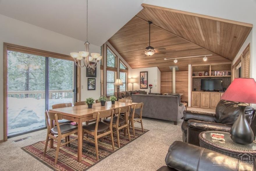 A background for Good Life Living!! This reverse living home boasts vaulted cedar wood ceilings, gas fireplace and a sought out location. The Master comes complete w/reading nook, extra large en-suite w/jetted tub and Heated Tile Floors! Take the inside out with the extensive deck complete with newer Hot Tub and an additional front deck for those sunset evenings. Abundant storage inside & extra private storage for all your toys and outdoor activities on the exterior. Ready for family and friends!