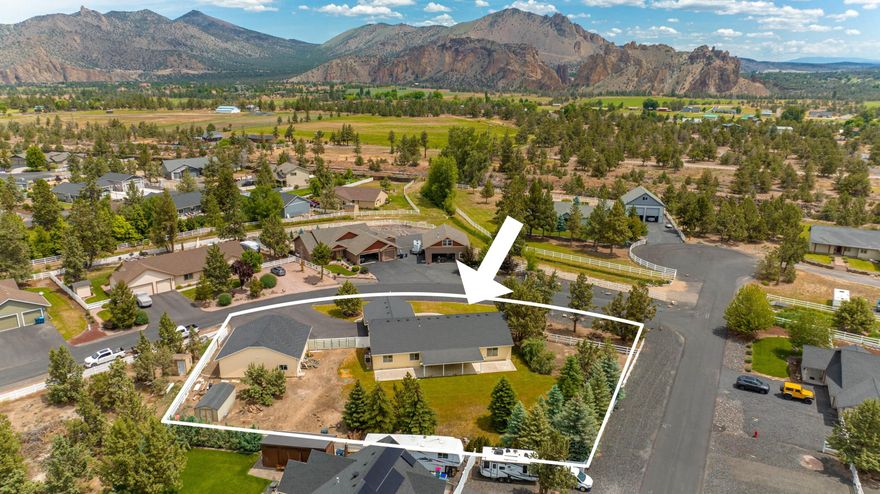 Located in sought-after Angus Acres in the heart of Terrebonne, this .68/acre corner lot features a classic SINGLE LEVEL design, fully-fenced property and a fantastic detached shop. Spacious Great Room offers vaulted beamed ceilings, wood flooring, gas fireplace and access out to the covered back patio and yard. Chef's Kitchen w/stainless steel appl, ample hickory cabinetry and expansive bar for informal dining. Light-filled Dining area w/peek-a-boo views of Smith Rock. Private Primary Suite overlooking the backyard features wood flooring, vaulted ceilings, generous walk-in closet, and ADA accessible shower. 3 additional BR and full BA w/dual vanity and shower/tub combo. RV/boat parking, 2 car attached garage + mudroom + approx. 1300 SF shop. Excellent proximity to Smith Rock State Park, one of the most magical outdoor enthusiast's locations in Central Oregon offering phenomenal rock climbing, stunning scenic river trail hiking and over 650 acres to explore and enjoy year-round.