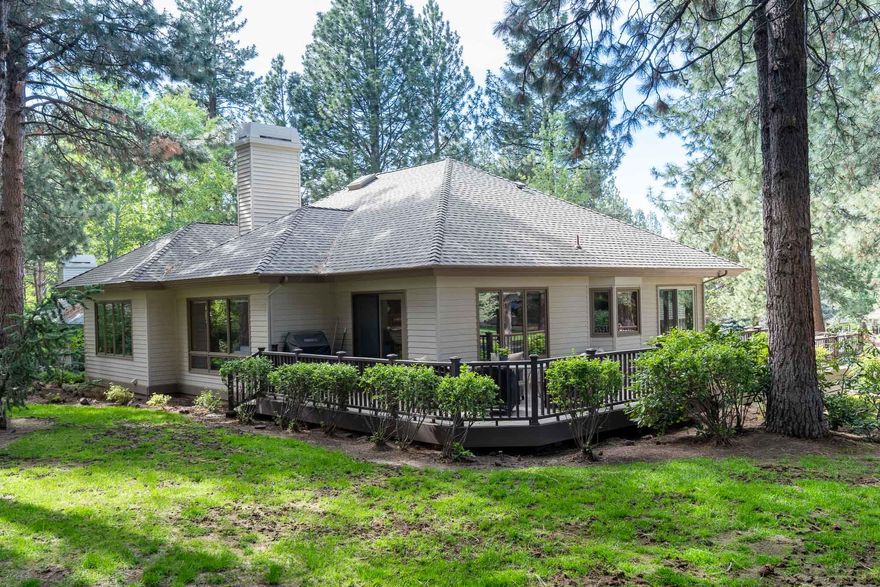 Beautiful, spacious 2BR/2BA plus den, single level home on a gorgeous corner lot. Located in gated Mountain High/Aspen Village. Slab granite in kitchen and hall bath. New Thermador dishwasher and range. Beautiful built in bookshelves on either side of the living room fireplace. Large master bedroom with walk in closet. Pozzi windows. Very large wrap around deck allows you to enjoy Central Oregon outdoor living at its finest! Jacobs ladder to access abundant storage above the garage. Owners also installed a 75 gallon gas hot water heater.  Service lift to access entry from the garage. Interior of the home recently painted. No short term rentals allowed.