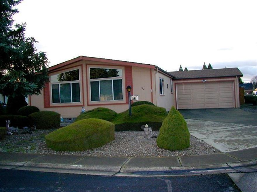This is a wonderful cared for home in one of the most popular 55+manufactured home Communities in the Valley! Home is on foundation and you Own the Land. There are 3 large bedrooms and 2 full baths. Master features vaulted ceiling, master bath and a walk in closet. Separate vaulted living and dining room with extra living space adjacent to the light and bright kitchen. The very private back yard has a nice shaded patio and a great storage building. this wonderful community is located just minutes from the downtown Central Point area with easy access to shopping and city services. The community also offers many extras including the wonderful recreation area with pool, spa/sauna/hot tub, weight room, library, billiards and much more. The $110 a month association dues includes garbage and sewer. Come enjoy what this home and neighborhood have to offer. It's a lifestyle!