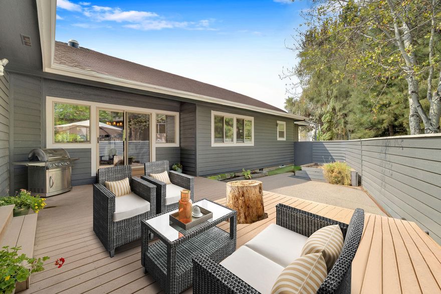 Turn-key Westside Bend living- move in, unpack, and enjoy from day one! This single-level, 3 bed, 2.5 bath home sits on a sun-filled 0.28-acre corner lot with a fully fenced yard, delivering privacy, space, and low-stress living in one of the most sought-after areas of Bend. The 3-car garage adds a rare Westside convenience. Vaulted ceilings, bright spaces, and hardwood flooring highlight the open, functional layout. The spacious great room features a gas fireplace and flows into a chef's kitchen with quartz countertops, high-end appliances, breakfast bar, and large island with gas range. The primary suite includes a sitting area, jetted tub, and direct access to the private and sunny backyard. Enjoy both morning and afternoon sun from the Trex deck and patio, perfect for outdoor relaxing or hosting.  Close to parks, trails, and restaurants, this move-in ready home offers the location, comfort, and ease - no projects, no delays, just effortless Westside living.