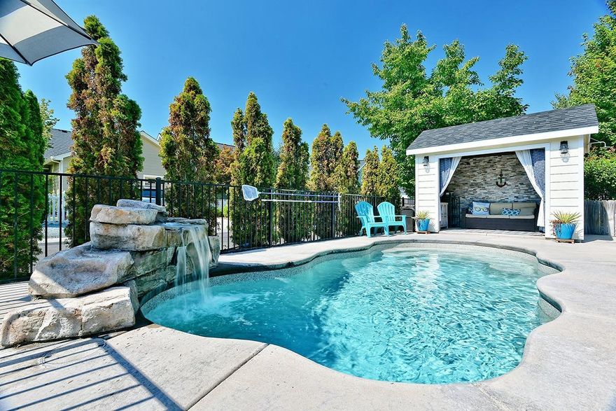 Buyer Alert! This home is sooo awesome with all the amenities you want!! Outdoor kitchen, rock fireplace with gas logs, flat screen TV, in-ground heated pool w/ waterfall, amazing arbor & casita overlooking the pool & an out door shower! Lg kitchen w/ granite counters & nice appliances. Lg great room w/ lg soaring ceilings & open railing staircase & gas log fireplace. Formal dining rm w/ wood floors & built in hutch, breakfast rm w/ built in wine rack & refrige, wine rack, walk in pantry. Lg laundry downstairs w/ a 2nd laundry rm upstairs. Great sitting rm & balcony upstairs plus a built in office library/desk. Lg family rm upstairs, good size bedrooms + a climbing rock wall to a finished attic bonus room above the climbing rock wall (not incl. in sq ft) w/ heat & A/C. This is one cool home & location