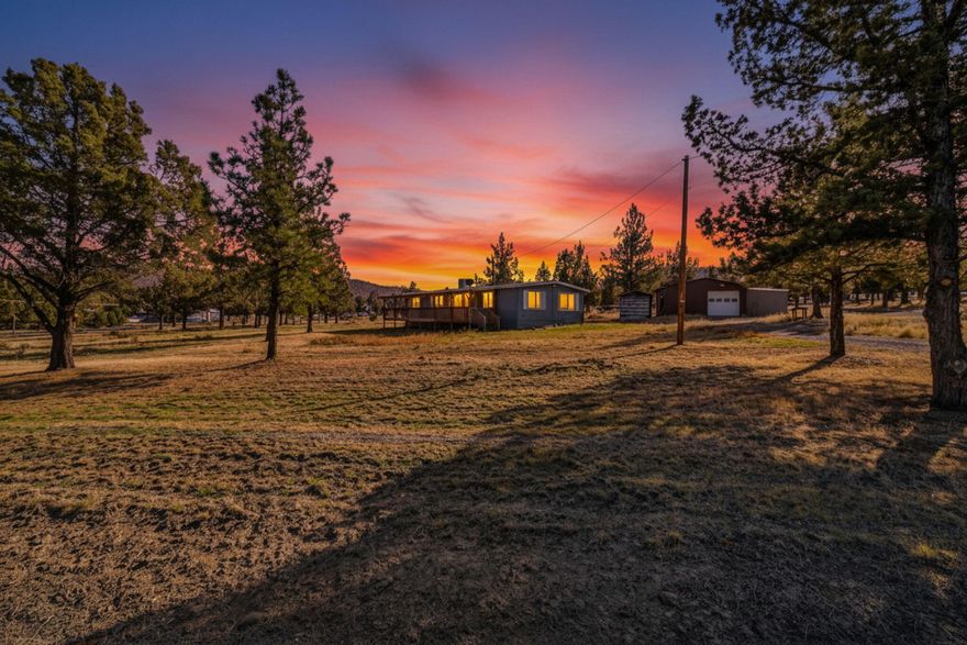 Beautifully updated 3 bedroom, 2 bathroom home on 1.9 acres in the Highlands Subdivision. Enjoy all the perks of a quiet, established neighborhood, it's even on a corner lot! Step inside to discover fresh interior and exterior paint, new carpet, and vinyl flooring, and a recently resealed roof for added peace of mind. The home also features 2 ovens, a new electric water heater, updated plumbing under the home, and electric forced air heating plus a roof mounted swamp cooler to keep you comfortable year round. Outside, you'll find outbuildings, including a 1 car garage with an attached workshop equipped with 220 power - perfect for hobbies, storage, or a home based business. With community water, ample space to roam, and the rare combination of rural privacy and neighborhood charm, this move in ready property won't last long! Property is grandfathered in and not in the POA.