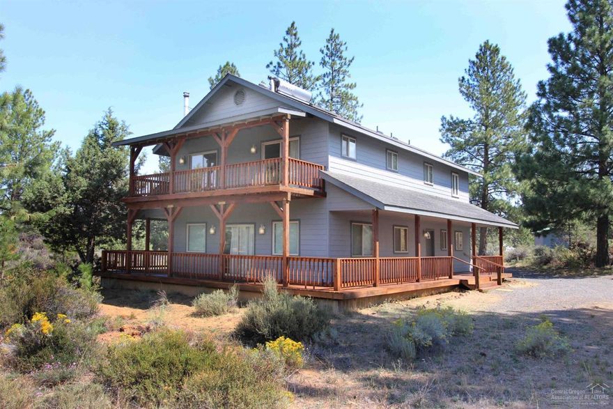 Nestled on 8.96 acres, this well maintained 4 bedroom + Den + Office &amp; 3 full bath home has 2 masters up. Open kitchen w/island overlooks Great Room. Privacy &amp; close to all Bend amenities. Wraparound deck, large garage w/separate bath &amp; shower. Area for a shop + bonus room upstairs. Laundry room w/sink. Lots of storage, RV parking. Woodstove + A/C &amp; heat pump. Must be seen to appreciate the possibilities. Perfect property to build your own Horse corrals &amp; barns. Potential living&nbsp; space above detached Garage.