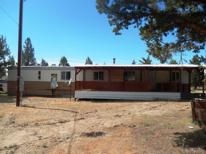 Value is in the land! This is a diamond in the rough. Either remodel the existing manufactured home or build your dream home on this Prineville Lake Acres parcel. Close to the Prineville Reservoir, hunting & fishing, and water sports. Priced to sell!