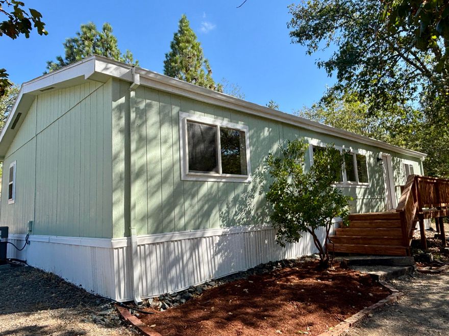 Peaceful country living with the convenience of being just minutes from downtown Grants Pass! Beautifully remodeled 3 bdrm, 2 bath home on 4.09 acres of rolling land, offering privacy, space, and stunning views. Open floor plan and a spacious master suite with walk-in closet, double vanity, and private bath. Brand-new roof, new heat pump/HVAC, and luxury vinyl plank flooring throughout. Updated kitchen with beautiful hickory cabinets and modern farmhouse finishes. The southwest facing deck is perfect for relaxing and enjoying the sunset. Fruit trees and a seasonal creek and pond. With 4 acres of rolling countryside, this property offers plenty of room for adding a shop/garage, RV/boat parking, gardening, animals, or simply enjoying the quiet rural lifestyle while still being close to town for shopping, dining, and amenities. Enjoy all this property has to offer, plus owner will provide a home warranty!