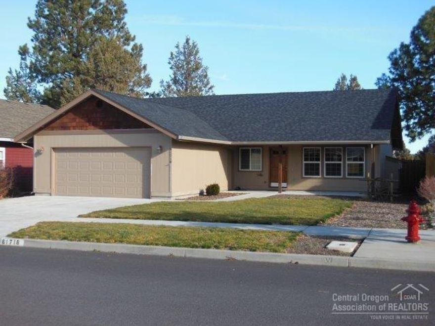 Wonderful combination of location, setting and home. Single level 2 bedroom, 2 bath, 1288 square foot home built in 2009. Large covered entry/porch for convenience and enjoyment. Comfortable living/dining room with gas fireplace. Spacious master suite. Oversized double garage. Covered rear patio with fenced back yard. Property borders COID canal. Close proximity to park and forest trails.