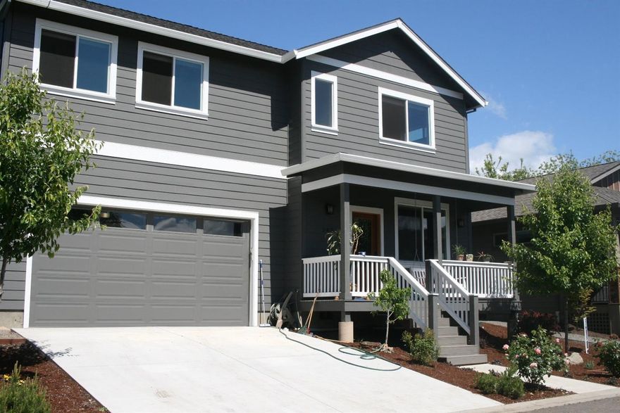 Beautiful newer 4 bedroom, 3 bath home built in 2013. This home comes with lots of amenities including, hardwood doors and cupboards, built in surround sound stereo, granite counter tops, hidden cables for built in entertainment center, ceiling fans throughout and dual water tanks. Nice open floor plan with a large laundry room that includes a utility sink, a spacious kitchen with wrap around counters that opens to both the living room and dining room. Beautiful hardwood flooring on lower level and carpeting on upper level. Large master bedroom has a vaulted ceiling and dual entry closet with lots of space. Master bathroom comes with dual sinks, all marble shower with 3 separate showerheads and a soaking tub. Sliding back door leads to a spacious deck that's perfect for hosting BBQ's or relax out front on the covered porch.
