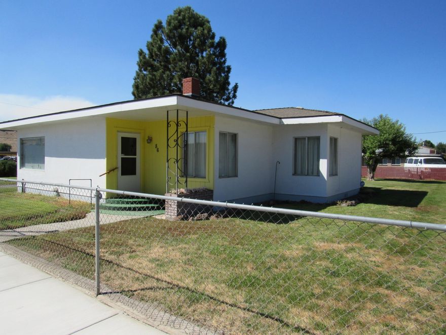 An older home that is in really nice condition. Just across the street is a city park, complete with picnic tables, water park, and covered pavilion. The home is served by city water that is provided by opal springs, and the grounds can be watered by the property's own well.  The single car garage was converted long ago into an office/storage area. The home is cozy and warm and conveniently located.