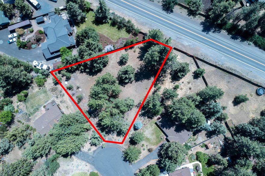 Perfect opportunity to build a dream home with plenty of room for shop, etc. On large oversized flat lot in well-established SE Bend Neighborhood on quiet cul-de-sac with plenty of mature trees. Zoned RL with water & electricity are stubbed to the lot.