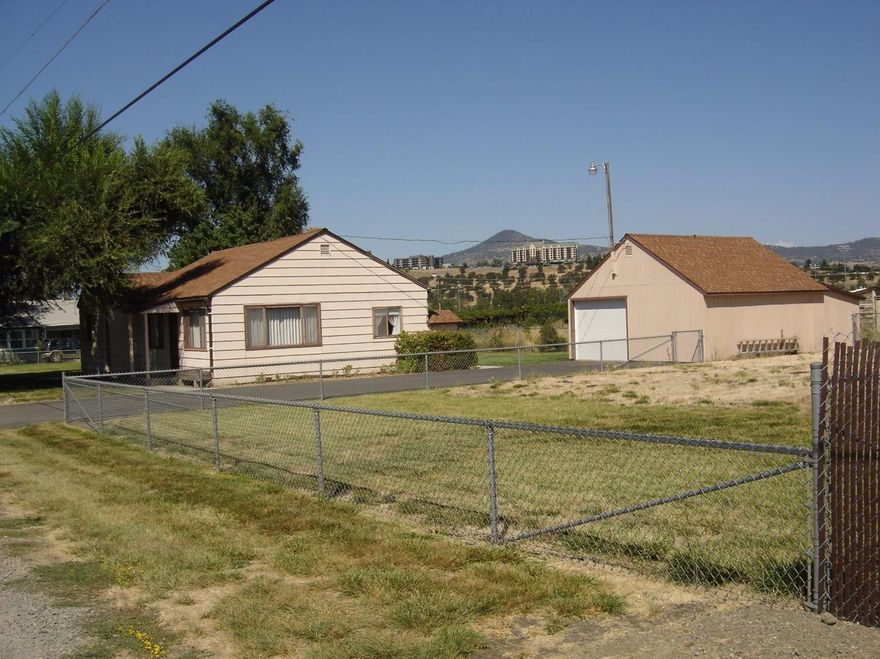 A comfortable and cozy 2 bedroom 1 bath home on a large 1 acre country lot is waiting for you to call home. Country feel yet close to town on this quiet dead end street. Nice open views from both front and back property with lots of elbow room. Home is original clean and tidy. Hardwood floors under carpet. Remodel existing home or plenty of potential to add on. Detached garage/shop. Property is fenced and cross fenced with room for animals or to park your RV or trailers. There is also room for a large shop, pool, garden.... so many possibilities for this Country Gem.