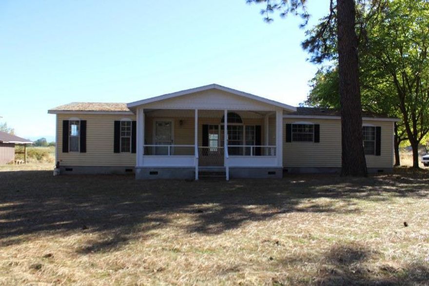 Very desirable country living yet close enough to not feel isolated. Seller has installed new laminate flooring, tile in the master bathroom, soaking tub, walk in closet and separate floor plan. Water softener, new paint outside and more. Full RV hookups (inc 220) are intact, barn with potentially 4 stalls, loft and ability to hold ? ton of hay. Green house, 4 x 8 chicken coop, 20 X 24 shop with 220, dog run and more. Incredible view of the annual pond which at high water encroaches upon TL 313, per survey and Jackson County Online Property Data. Seller states good well. 5-6 GPM and has never run dry even with watering numerous animals. Seller installed new pump and sediment filter December 2015. Sprinkler drip system for lawn has back flow valves. Sun room was added on with permits. Plenty of room for 4-H projects and a large garden. Sky lights, wood fireplace with hearth, UV system for well, water softener (owned), ceiling fans and more. Garden area is enclosed with deer fencin