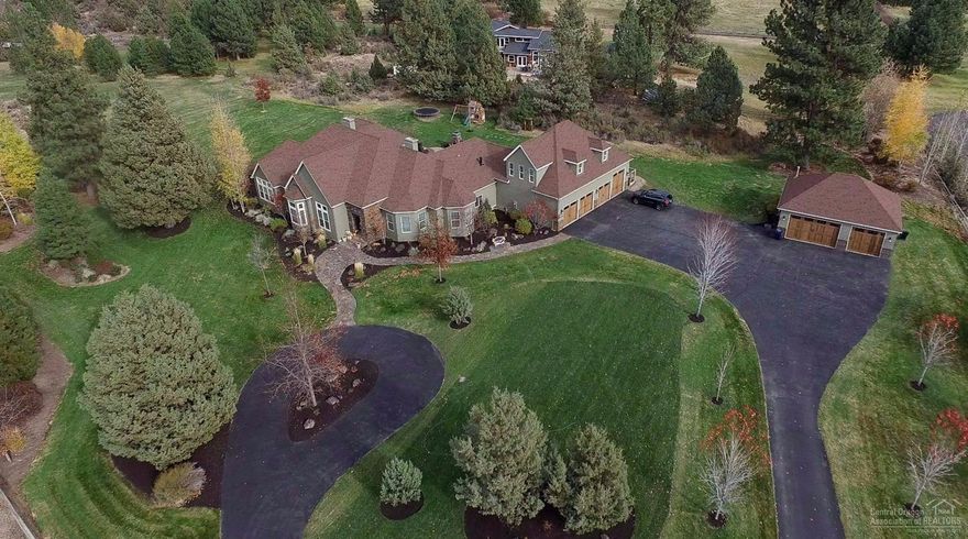 This amazing estate is like nothing else in Bend! Entirely 1-level except bonus rm over garage. Thoroughly remodeled w/ high-end finishes & custom craftsmanship. 4 bdrms have private bathrooms. Large living & dining areas, perfect for entertaining. Gourmet, custom kitchen features hand chiseled, Cosmos stone counters. Entertainment room w/ wet bar, 1/2 bath & reclaimed barn wood wall. Wine tasting room. Large, exquisite master suite w/luxurious amenities. Located on 3.7 private acres w/ 2.8 ac of irrigation