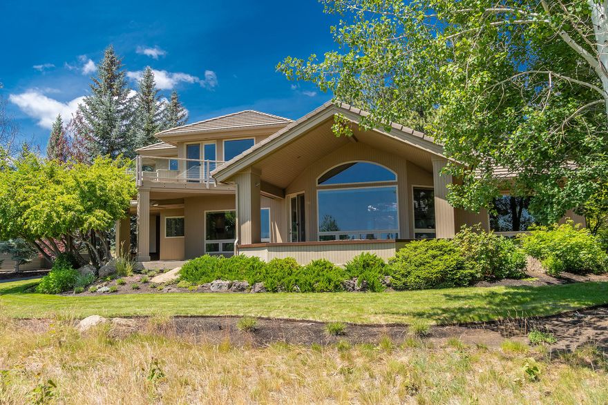 Stellar views from the green all the way down the12th fairway from this gorgeous Steve Madsen home. Contemporary Northwest design and finishes create a sense of fresh, sleek sophistication with windowed walls allowing natural light to spill throughout each room, while the sand-in-place beechwood flooring adds the perfect touch of warmth and coziness. Extensive remodel by Madsen Homes includes a main-level master suite retreat with golf course views and spa worthy bath, a jr. master suite is also on the main level with an additional full master suite and wood paneled office/library with gas fireplace up. Open concept great room is accented by cantilevered bookcase niche and porcelain tile wall with floating fireplace. Carrara marble backsplash highlights the Gourmet kitchen with double ovens, induction cooktop, 2 drawer Fisher Paykel dishwasher and breakfast bar. Even the garage is fabulous with epoxy flooring and separate bay that includes heat and a/c.