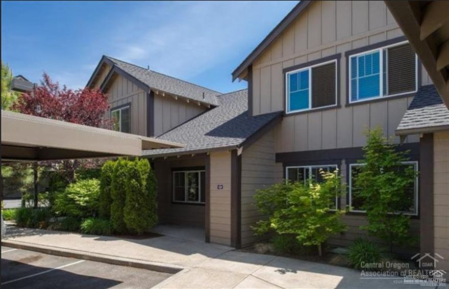 Westside condo near COCC with large MAIN LEVEL MASTER. Great Room with vaulted ceiling and wood floors. Open kitchen with stainless steel appliances. Two bedrooms and loft upstairs. 1 deeded covered parking space, patio storage, and under stair storage. HOA covers fitness room, sewer/water, exterior maintenance, snow removal, landscaping and master insurance. Near downtown and Newport Market! Covered dedicated parking spot is space 10.