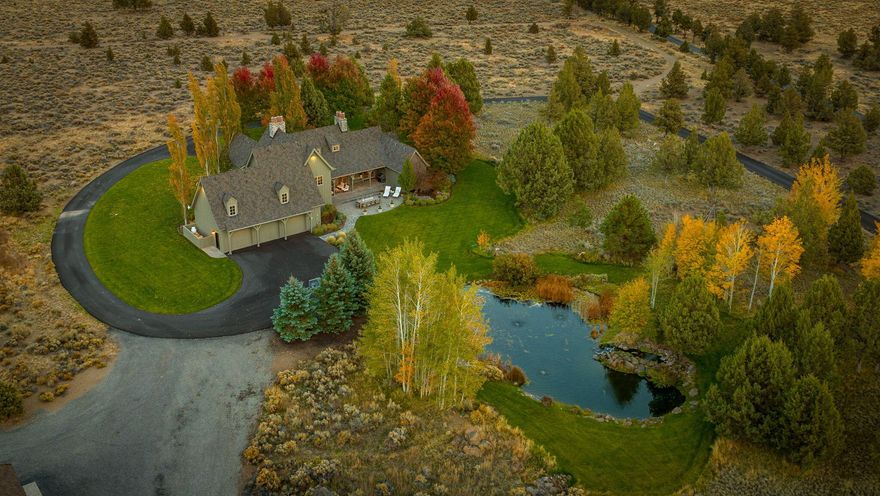 For comps only.  Impeccably maintained and exquisitely designed 40 acre Tumalo estate blends the natural, rugged beauty of the high desert with the serenity and harmony of home.  Set against a scenic backdrop of stunning Cascade mountains and bordering BLM land on three sides, this breathtaking setting includes numerous old growth trees, a beautifully manicured lawn, a sparkling pond and sweeping views of the high desert landscape.  The traditional home has an open great room with vaulted ceilings, lodge style beams, wood burning fireplace and French doors that open to a covered patio.  Well appointed kitchen w/high end appliances opens to a cozy family room with fireplace.  Private dining room w/14 foot ceilings.  Primary Suite w/ luxury bath and large walk in closet.  Three guest rooms upstairs, one w/ensuite bath.  Detached 2,243 foot ''barn'' features a high quality, finished living space w/full bath and a huge separate area with 14 ft sliding doors for multiple vehicles.