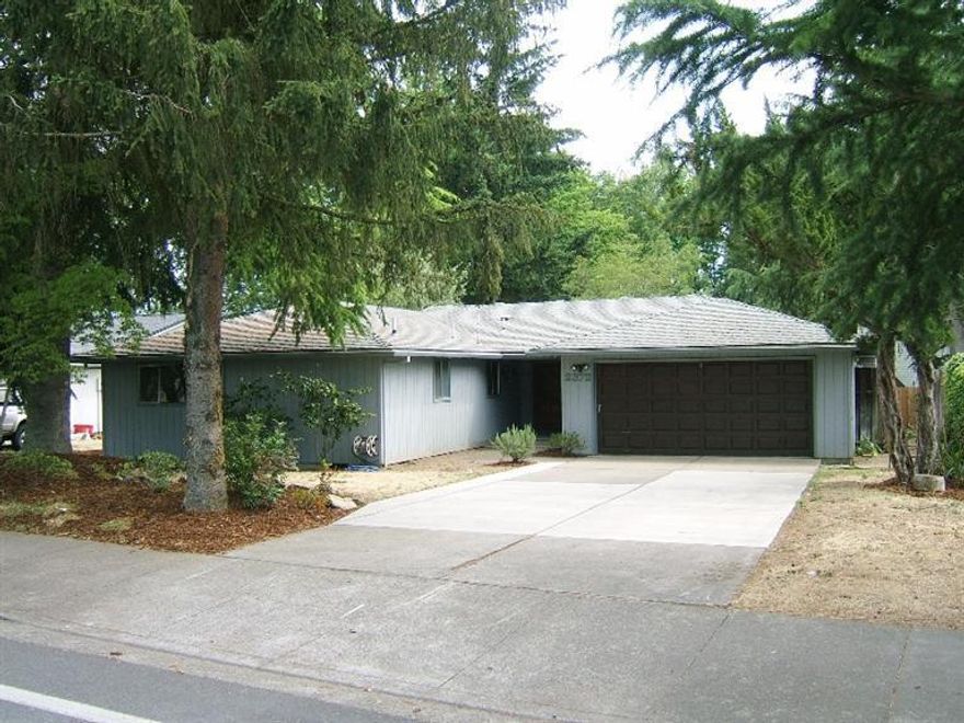 Enjoy single story living in this lovely home with NEW flooring (carpet & vinyl), NEW stainless steel kitchen appliances, entire interior has NEW paint, inside laundry closet, privately fenced backyard with covered deck, and attached two car garage. You have a kitchen/spacious family room with woodburning fireplace and formal dining room open to a large living room also. Master suite is a large room with walk-in closet and full bath. Second bedroom is good sized as well with a full bath right by it. Fantastic location across from Hoover Elementary and walking distance to Holmes, Ruhl and Bear Creek parks, all well known and delightful parks in the old East Medford area. Hospital, Country Club and shopping are within blocks of this home as well. Price is superb and home is available for immediate close and possession. Buy NOW to enjoy your summer in the home and the great area within which it is located!